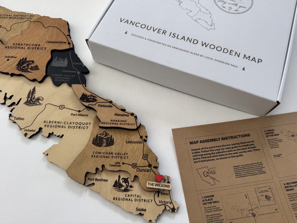 Handcrafted Vancouver Island wooden map with a personalized family sign and family name pin to mark your place.